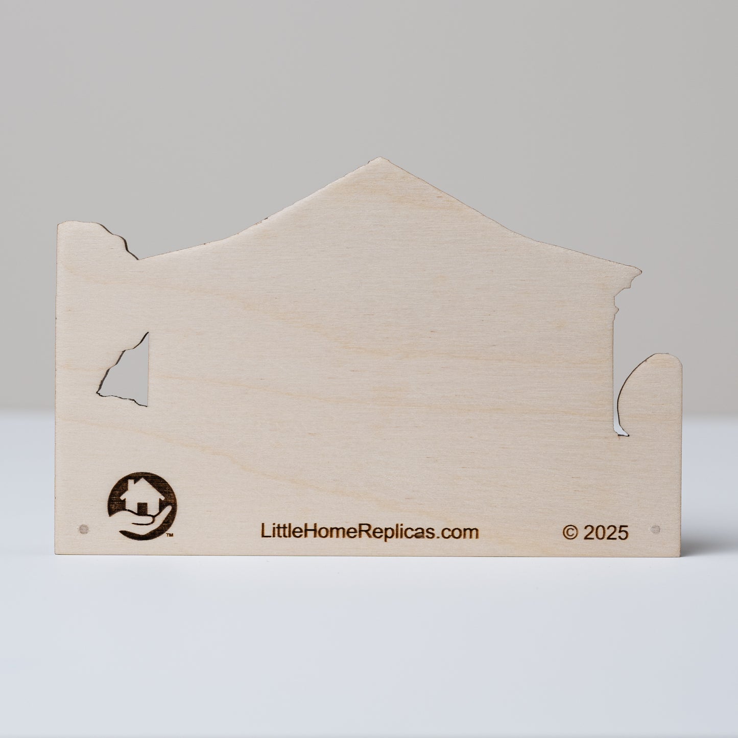 Wooden house-shaped replica with a plain back showing 'LittleHomeReplicas.com' branding on a gray background
