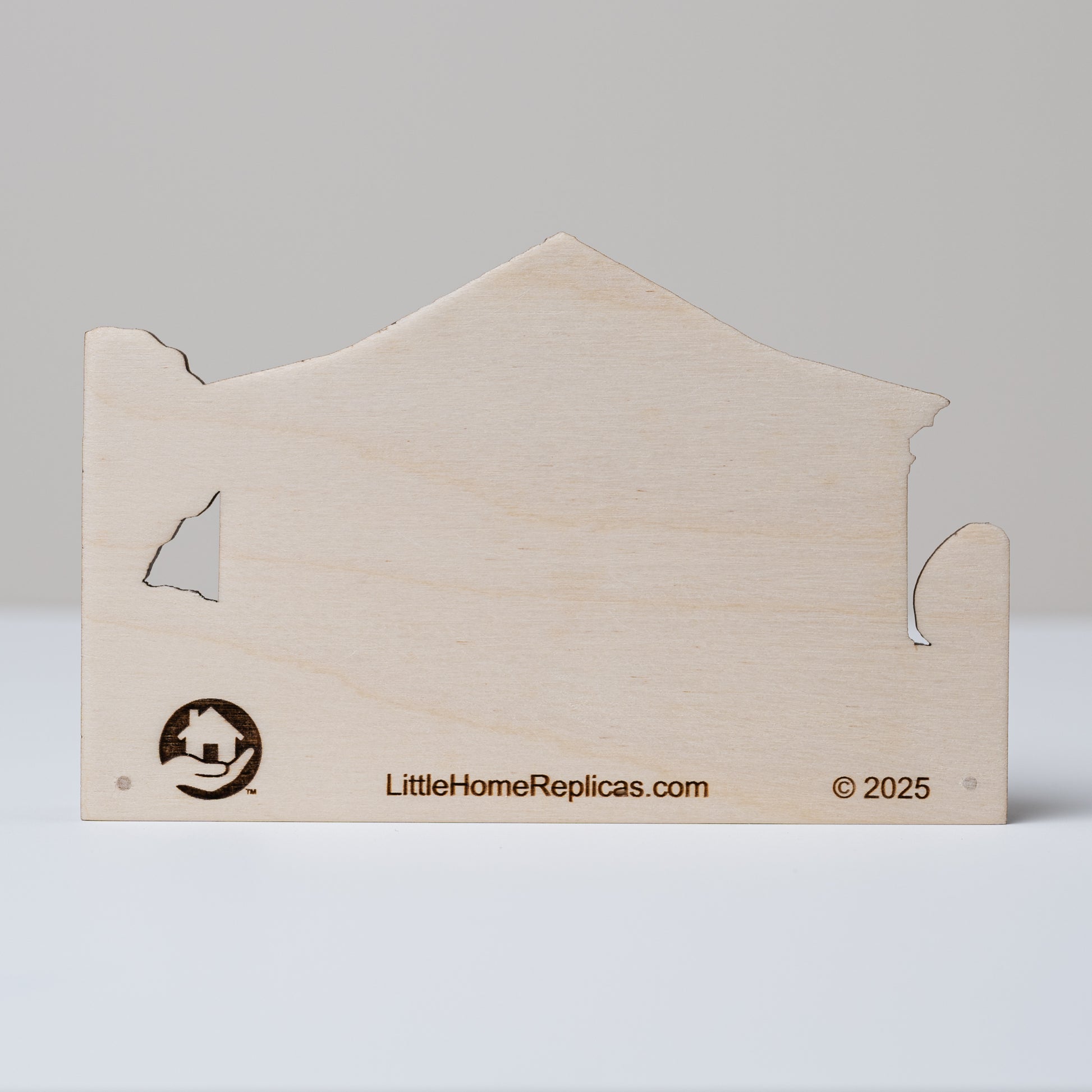 Wooden house-shaped replica with a plain back showing 'LittleHomeReplicas.com' branding on a gray background