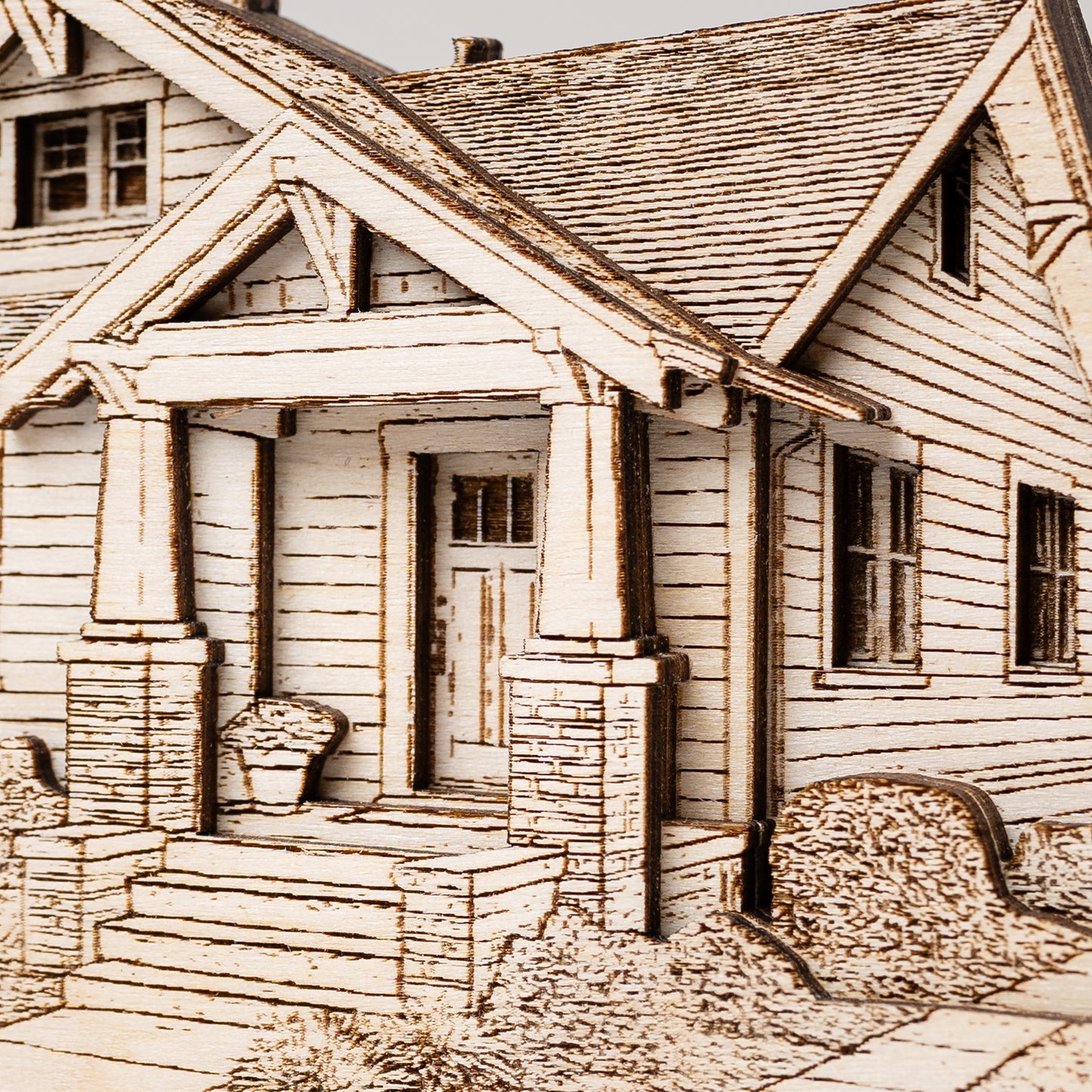 Detailed illustration of a house with a porch and steps.