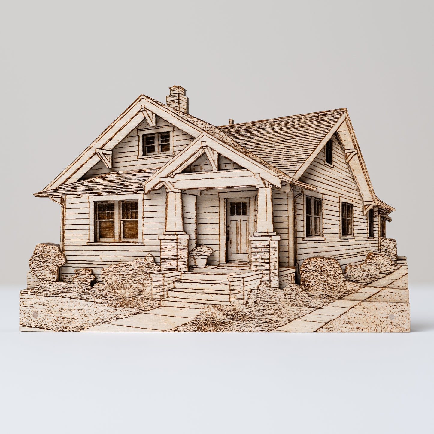 Wooden model of a house on a white background