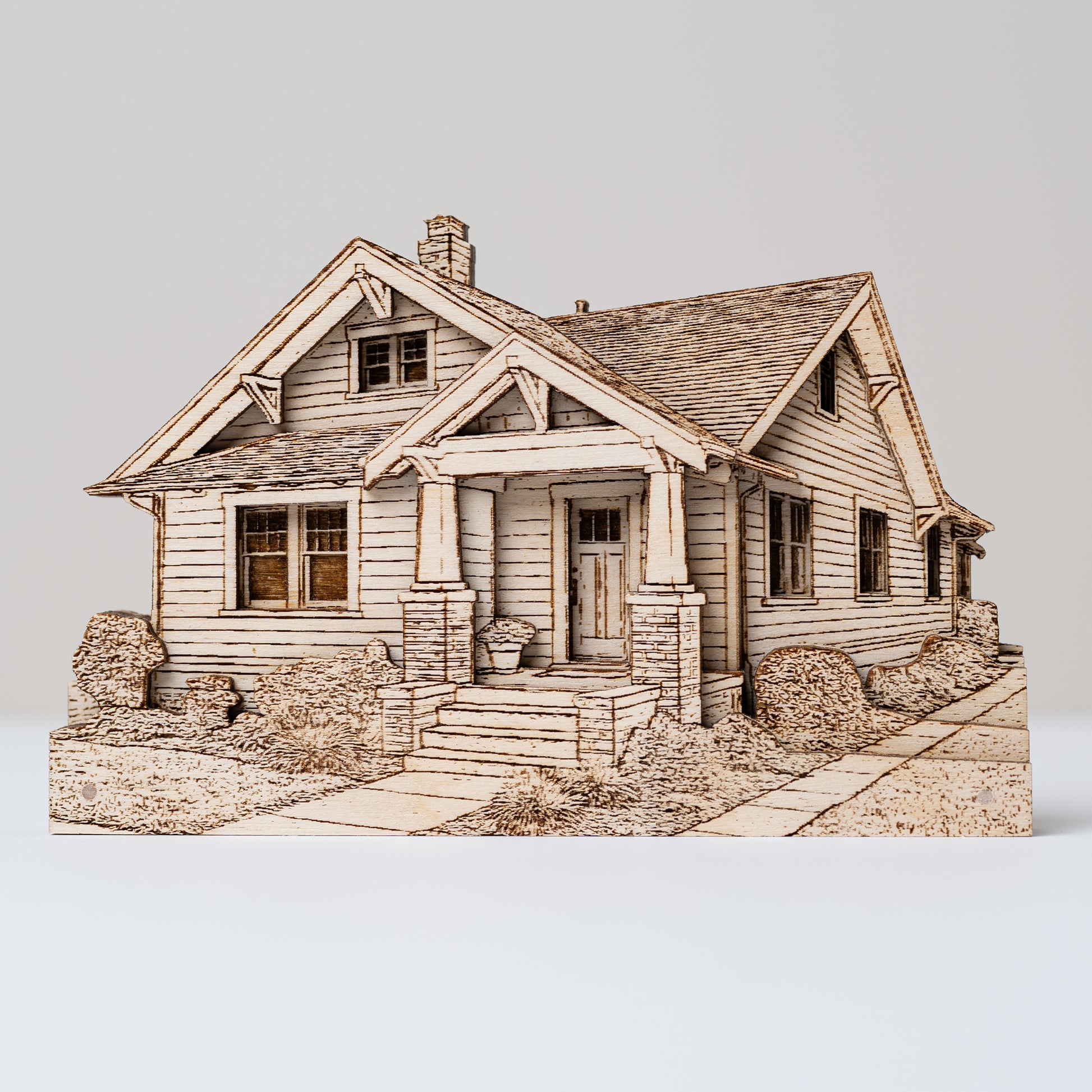 Wooden model of a house on a white background