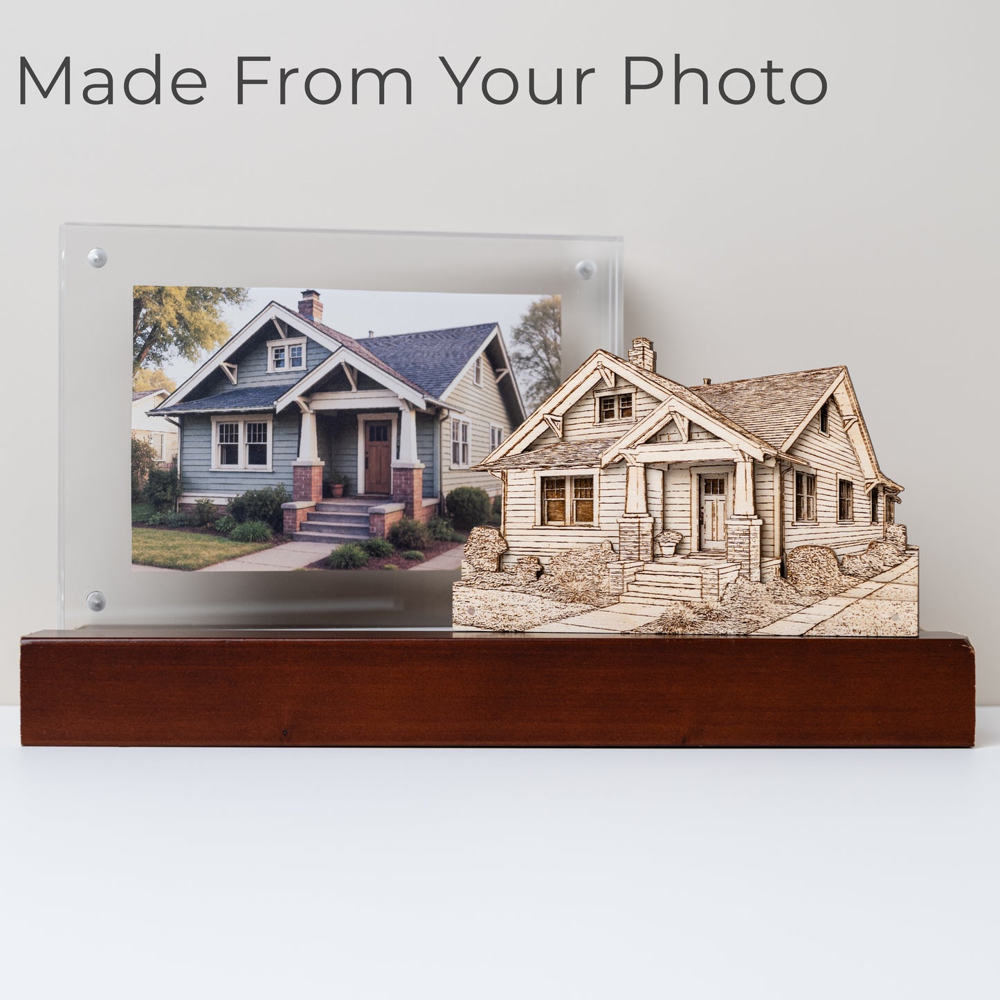 Wooden model of a house with a photo of a real house on a stand, with text 'Made From Your Photo'.